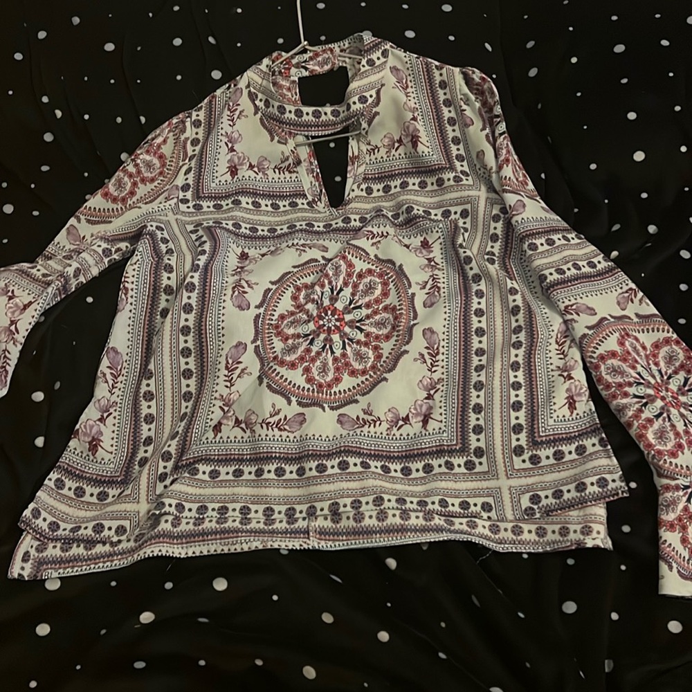 Dress or casual light shirt.Runs a little small but flows.